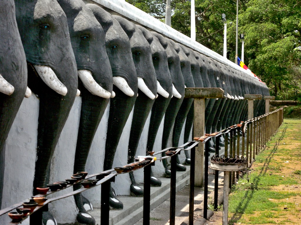 King Dutugemunu of Sri Lanka built stupa known as Ruwanwelisaya, the wall is decorated by 1900 heads of elephants - Anuradhapura, Sri Lanka 