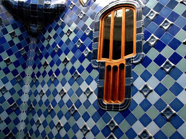 The light well of Casa Batllo covered the walls entirely in relief glazed tiles in varying shades of blue - Barcelona , Spain 