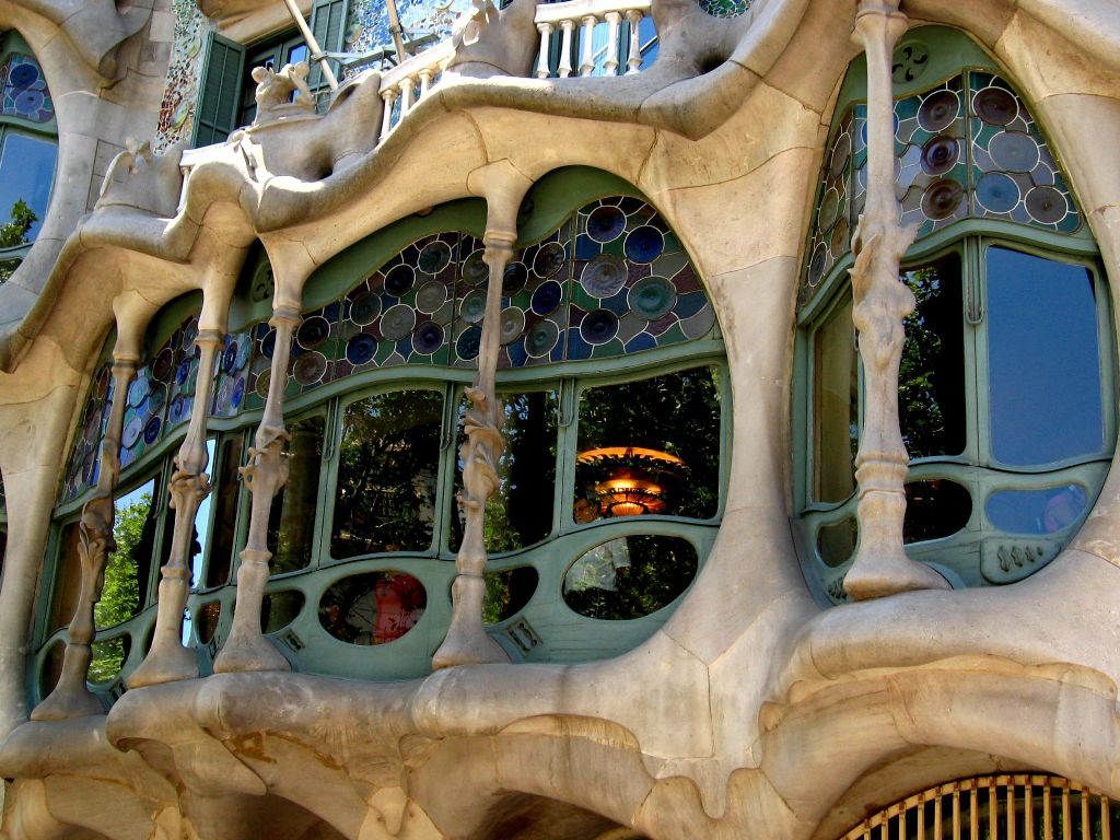 The design of Casa Batllo is complemented by joinery windows set with multicolored stained glass - Barcelona , Spain 
