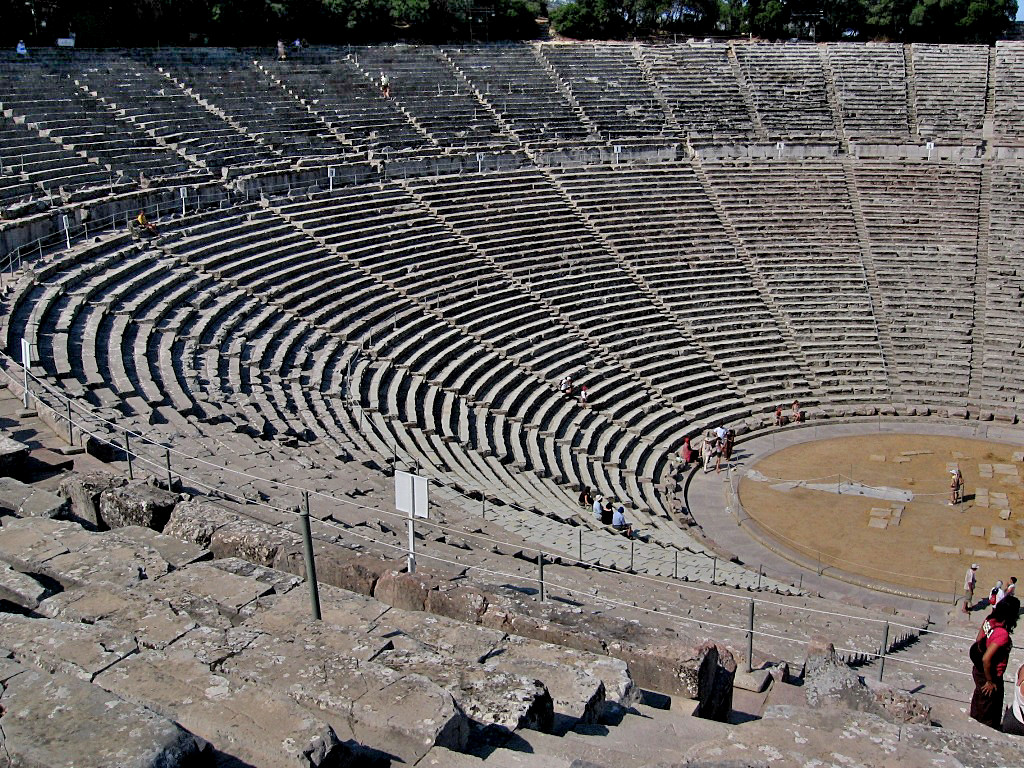 The auditorium of Ancient theatre in Epidaurus nestles perfectly into the natural curve of the northern slope of Mount Kynortio at an incline of about 26 degrees. It consists of two sections separated by a semi-circular aisle - Greece 