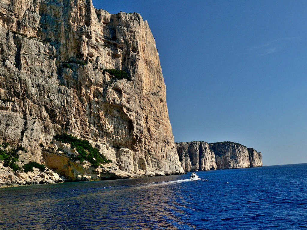 Golfo di Orosei - The Gulf of Orosei is one of the wildest coasts of Sardinia, purple limestone cliffs rise up from the sea like thousand-foot-high walls - Sardinia 